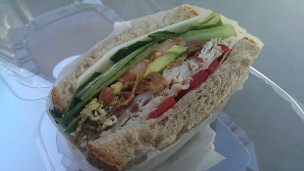 Turkey, provolone, lettuce, tomato, bacon, roasted red pepper, avocado on wheat. Excellent!