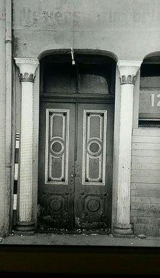 Paneled double doors typical of the 1865 period