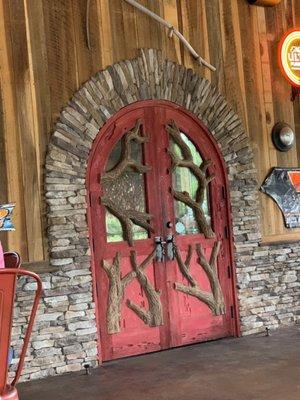 Back door into dining area. There's a covered porch with fans for outdoor dining.