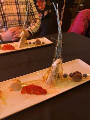 Dessert: a banana cake, hand made sugar pieces he made at the plating area, berries, macarons