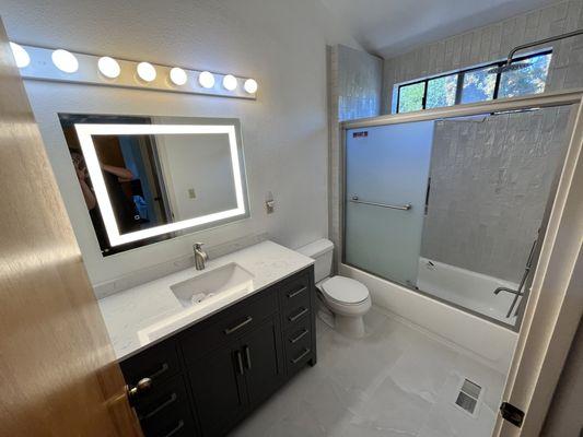 Bathroom remodel Santa Cruz California. New tile, New vanity, bath tub, shower faucet etc.