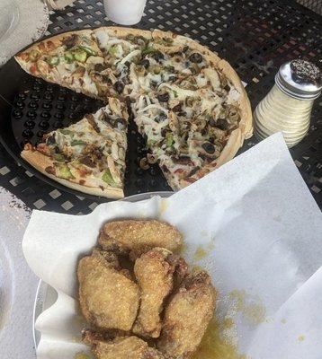 Veggie pizza with chicken added and Parmesan Garlic Wings.