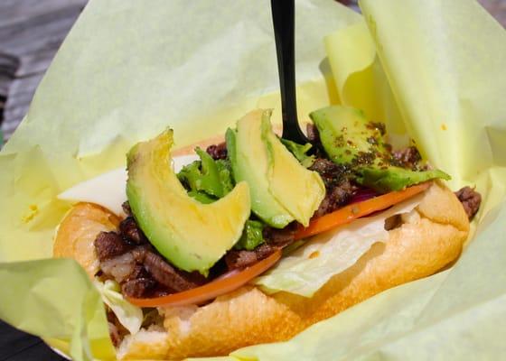 Their House Special Pichana - Grilled Top Sirloin w/ fresh romaine lettuce, tomatoes, vinaigrette, red onions, avocado