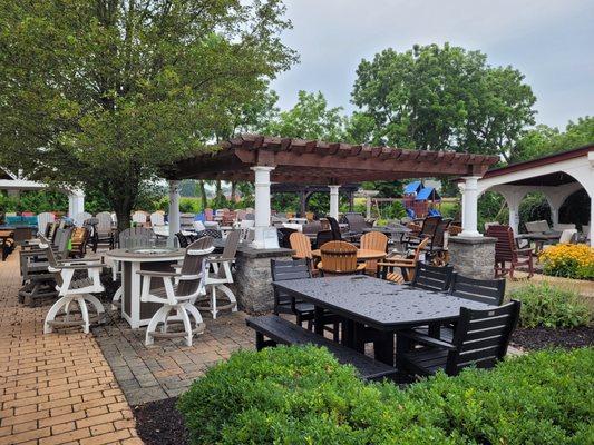 Poly furniture and Artisan pergola on outdoor patio.