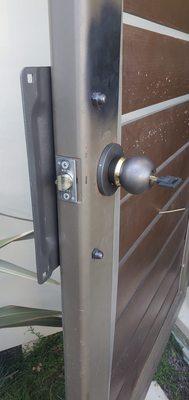 Heavy duty double side self locking lock installed on the metal door.