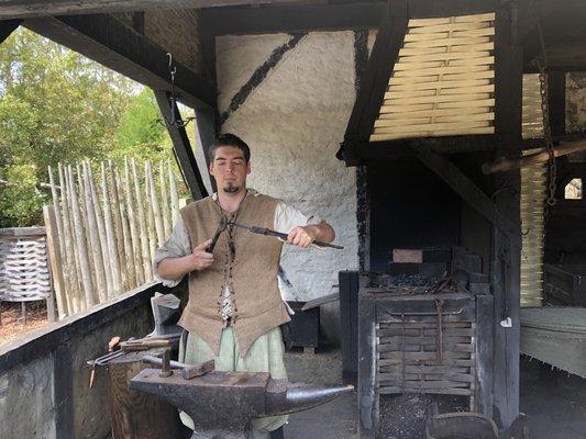 Blacksmith making an iron nail souvenir for us!