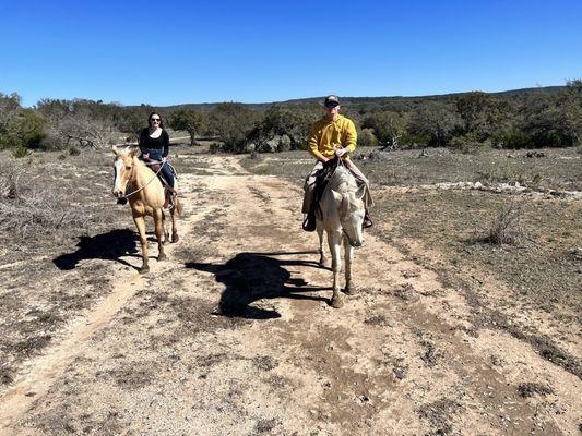 My husband and I on Travis' horses.