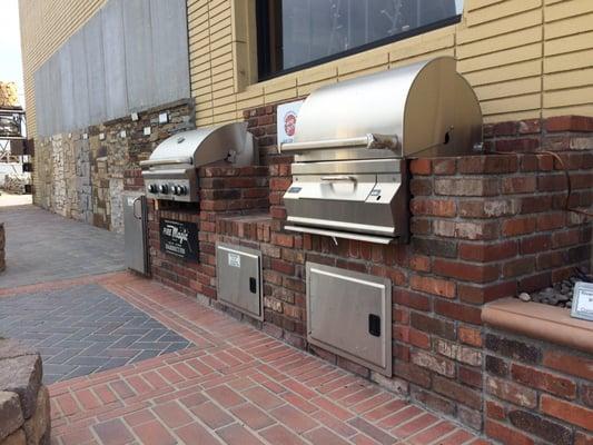 Firemagic charcoal grill and Aog 30nb grill on display with Firemagic legacy doors