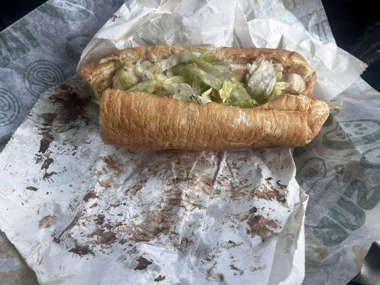 I was served this sandwich that looks like someone dyed their hair black with my food wrapper!