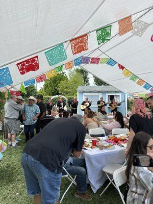 Family gathering and Mariachis in back ground