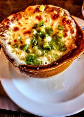 BAKED FRENCH ONION:
 A crock of our homemade French onion soup
 topped with a crouton & three cheeses.
 Broiled until golden brown!