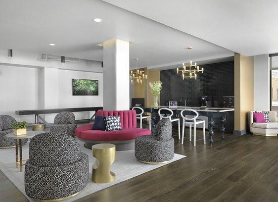 Contemporary club lounge with shuffleboard, coffee bar, kitchenette