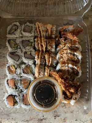 takeout: hamachi avocado roll (top left), salmon avocado roll (bottom left), cinderella roll (middle), spider roll (right)