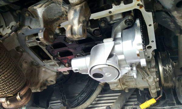 Oil pump replacement on a Mini Cooper.