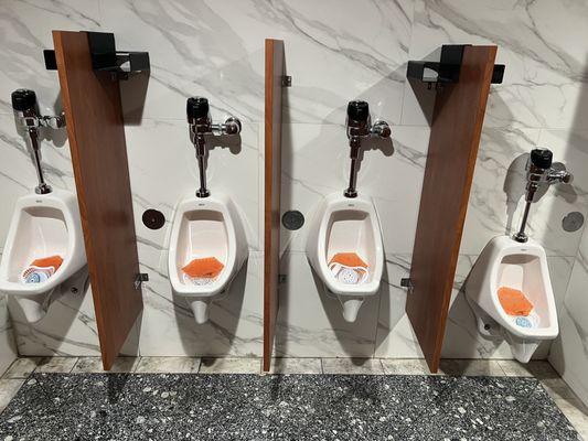 Hmmmm.  Gentlemen's clubs have kid urinals?