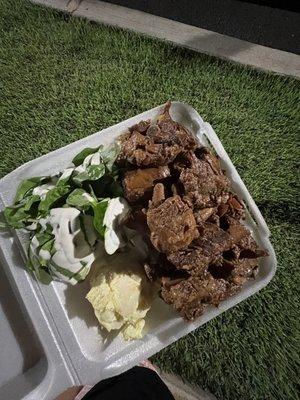 Spare ribs with rice, spinach & potato salad