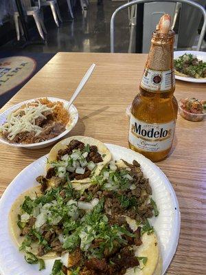 2 asada 2 al pastor tacos, rice and beans with a modelo