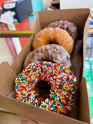 Donuts (front to back) - Chocolate Sprinkled, Blueberry, Glazed, Chocolate Glazed