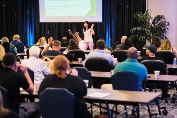 Lisa teaching at a conference about asset protection.