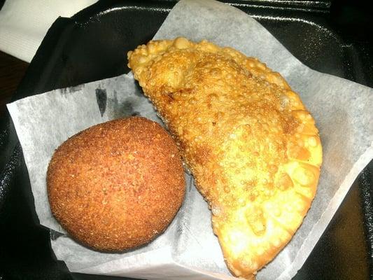 My lunch. Papa rellena (potato ball w/ savory ground beef inside) and empanada (beefy inside too).