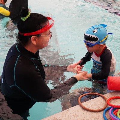 Instructor "D" with a little swimmer at our indoor pool located at Boost FitClub in Nashville/Belle Meade area.