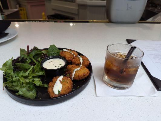 Broccoli cutlet with salad and rum and coke.