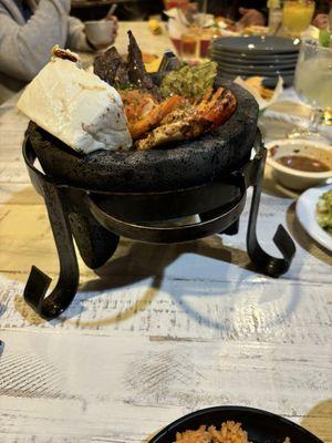 MOLCAJETE MIXTO Beef, chicken & shrimp with grilled cheese & veggies & salsa tatemada