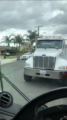 Vehicle parked against traffic without hazard lights on