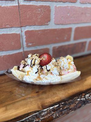 now offering banana splits with 3 scoops of ice cream of your choice, whipped cream, chocolate, strawberries, and topping of your choice.