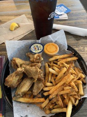 Lemon pepper wings with seasoned fries and tea