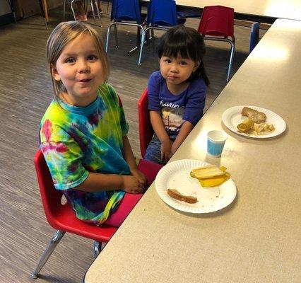 Preschool snack time is better with friends.