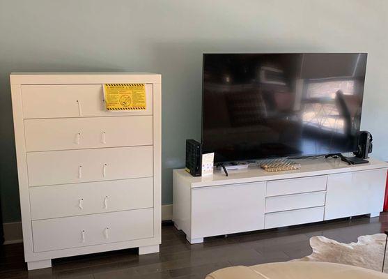 a white chest and TV Stand