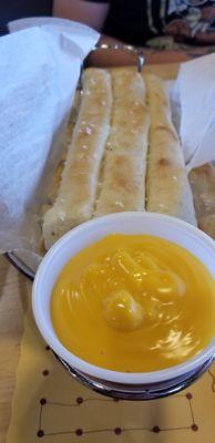 Breadsticks and cheese sauce