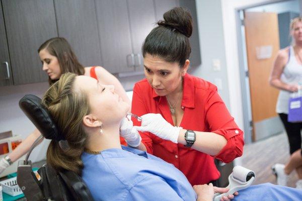 Our Expert Injector Christina Kang, RN demonstrating a Kybella treatment for reducing the double chin non-surgically