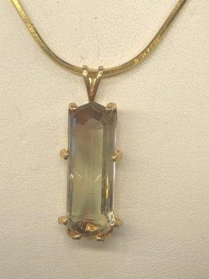 Large Trichroic Green sunstone cut by us with matching custom made pendant.