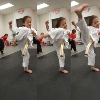 Lil dragons learning multiple round kicks. Deija learning just how awesome she can be with head level kicks!