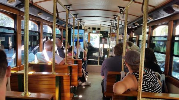 All the cool kids sit on the back of the bus. You can see what every one else is doing and no one can see what you're doing!