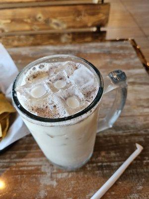 A horchata with cinnamon sprinkled on top, just like she said they don't do.