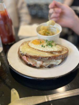 Croque madam with sunny side up egg and Mac & cheese.