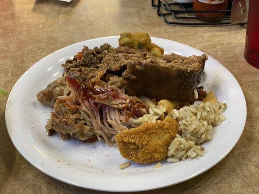 Pulled pork, fried fish, dirty rice, and Mexican beef