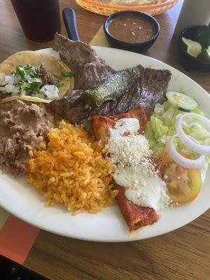 Steak, cheese enchilada, fajita taco, rice and beans