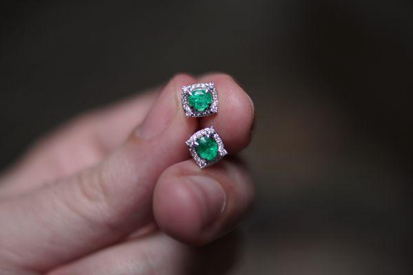 Emerald earrings with diamonds.