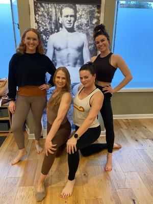 Our instructor team with our studio poster of Joe Pilates :o)