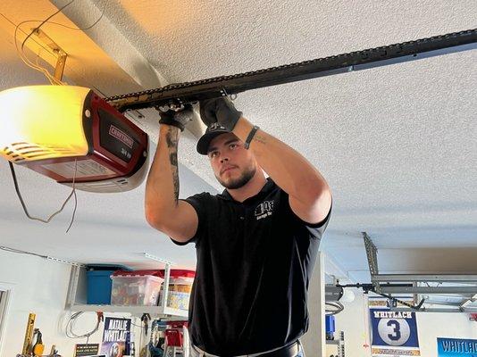 Tyson (service tech) adjusting a chain