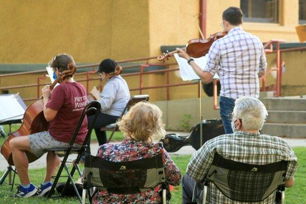 Audience and musicians socially distancing during a Reno Chamber Orchestra rehearsal. Summer 2020.