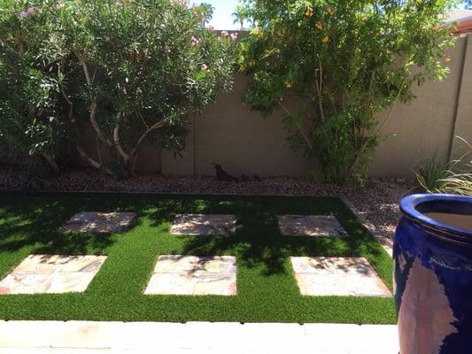 Ms. Billie's house after the turf installation. She says she loves her new lawn! 
 I think I do too.