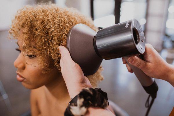 Anna diffusing curly hair. Did you know half of our guests have curly hair?