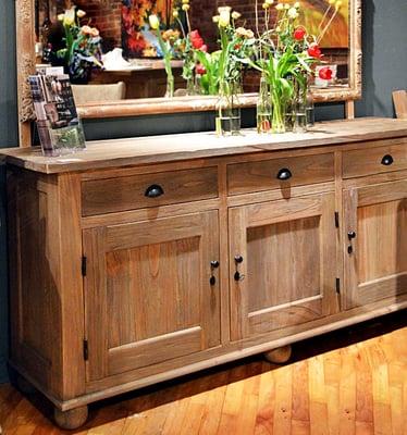 The Derbyshire's showroom features a large selection of pieces made of reclaimed wood with a distressed finishes