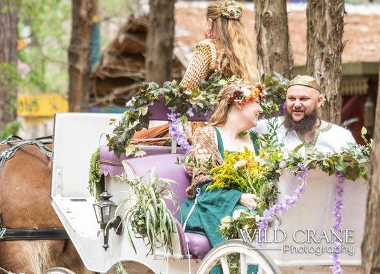 Bride & groom in carriage.