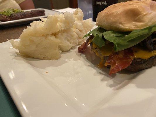 Burger w/ lettuce, sautéed onion, bacon, cheddar cheese, and mushrooms and mashed potatoes